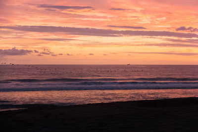 Scenic view of sea against sky at sunset