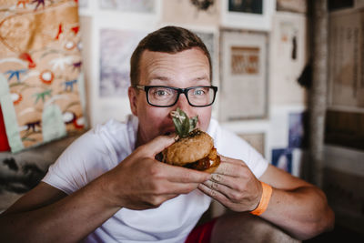 Man eating burger