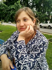 Portrait of beautiful young woman in park