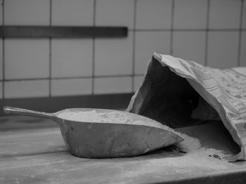 Close-up of cement in scoop on table at home