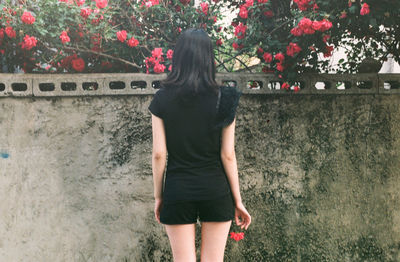 Full length rear view of woman walking outdoors