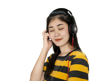 Portrait of mid adult woman against white background