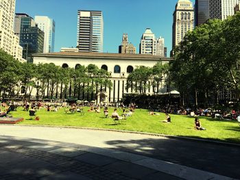 People in park with city in background
