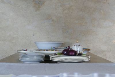 Close-up of food on table against wall