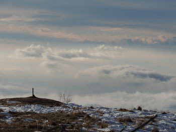 Scenic view of landscape against sky during winter