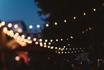 Defocused image of illuminated city at night