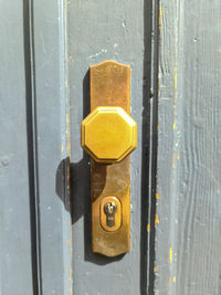 Close-up of yellow door handle