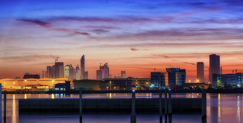 Illuminated city at sunset