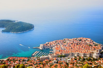 High angle view of townscape by sea