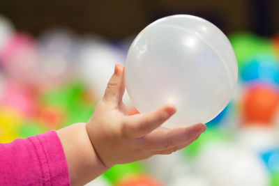 Close-up of hand holding ball