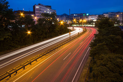 High angle view of light trails on road at night