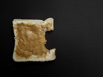 Close-up of bread on black background