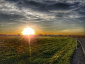 Scenic view of landscape against sky during sunset