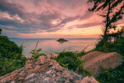 Scenic view of sea against sky during sunset