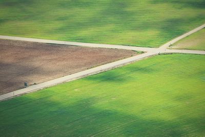 High angle view of road intersection on field