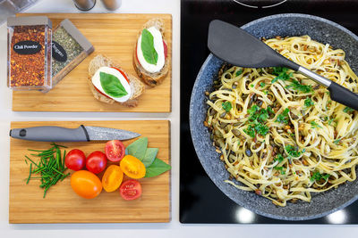 High angle view of fruits and vegetables on cutting board