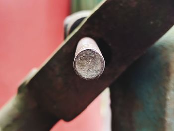 Close-up of rusty metal against wall