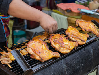 High angle view of meat on barbecue grill