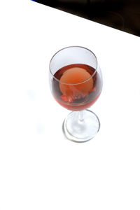 Close-up of drink over white background