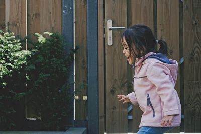 Cute girl running in yard