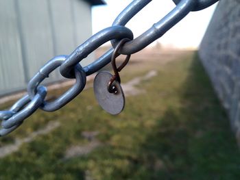 Close-up of chain hanging on field