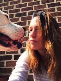 Close-up of woman looking at dog