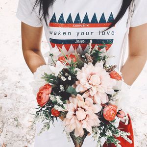 Midsection of woman holding flower bouquet