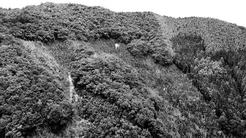 Low angle view of waterfall against sky