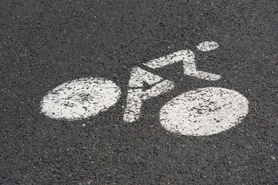 High angle view of arrow sign on road