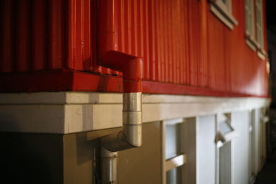 Close-up of empty seats against wall