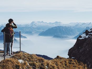 Woman standing on mountain landscape