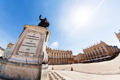 Low angle view of statue against sky in city