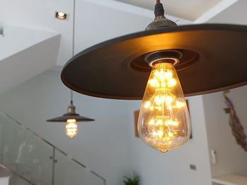 Low angle view of illuminated light bulb