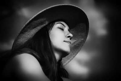 Close-up portrait of a young woman looking away