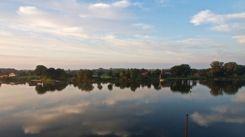 Reflection of trees in calm lake