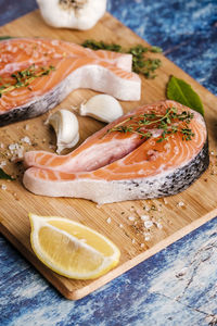 High angle view of fish on cutting board