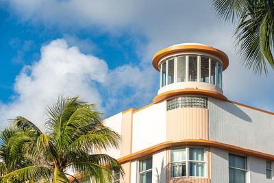 Low angle view of palm tree against sky