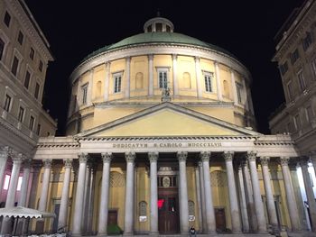 Low angle view of illuminated building at night