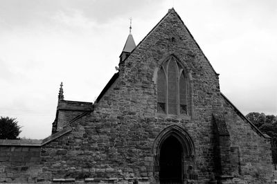 Low angle view of historic building against sky