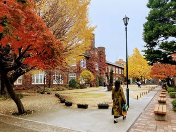 Rear view of man walking on street