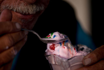 Close-up of man holding ice cream