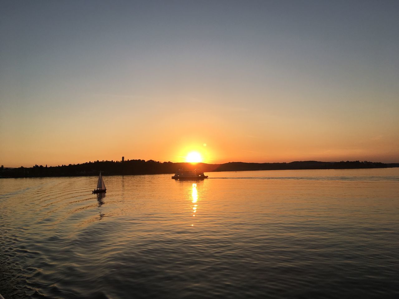 VIEW OF LAKE AGAINST SKY DURING SUNSET