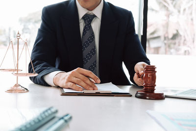 Midsection of man on table