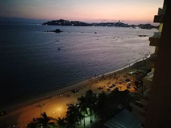 High angle view of beach against sky during sunset