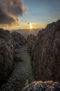 Rock formations against sky during sunset