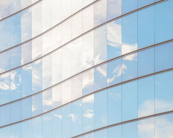 Full frame shot of glass building with reflection