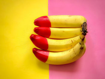 Close-up of multi colored candies against yellow wall