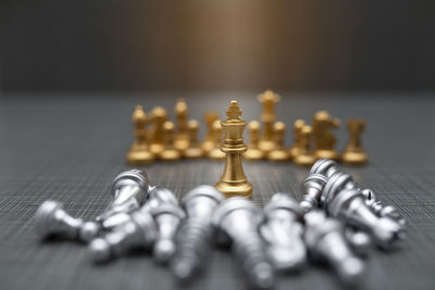 Close-up of chess pieces on table