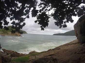 Scenic view of beach and sea against sky