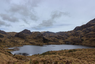 Scenic view of lake and mountains against sky